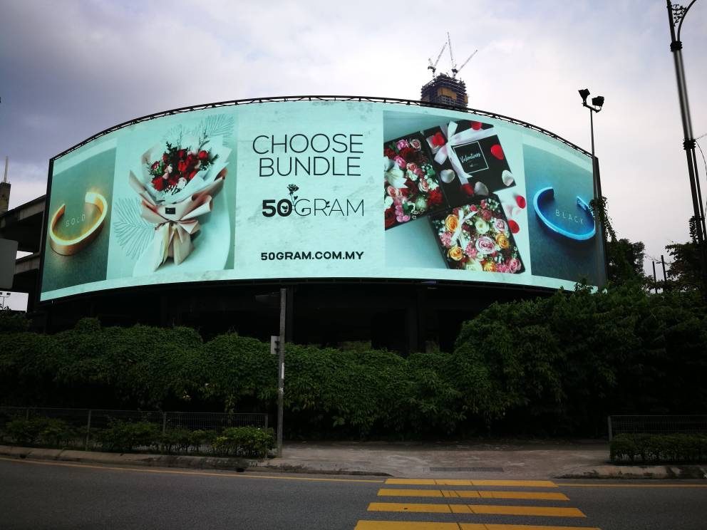 Curved LED billboard at Jalan Imbi, Kuala Lumpur, running a live campaign