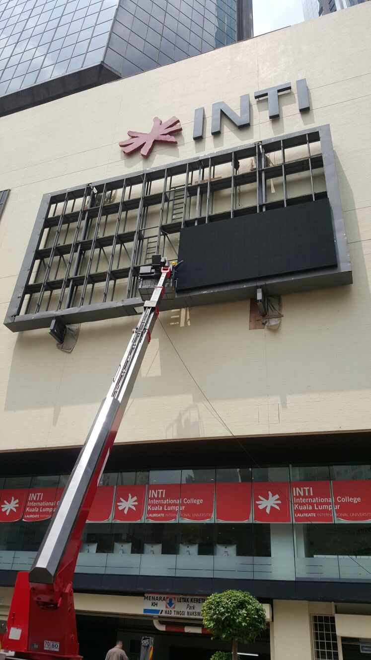 Campus LED screen installation with crane