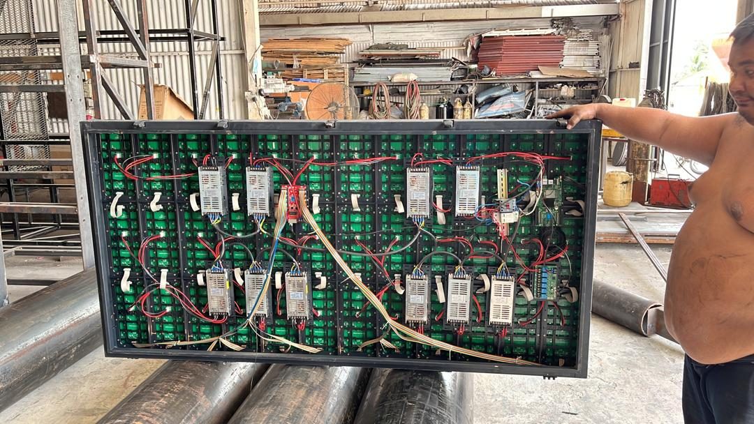 Rear of an LED cabinet showing receiving cards and power supplies