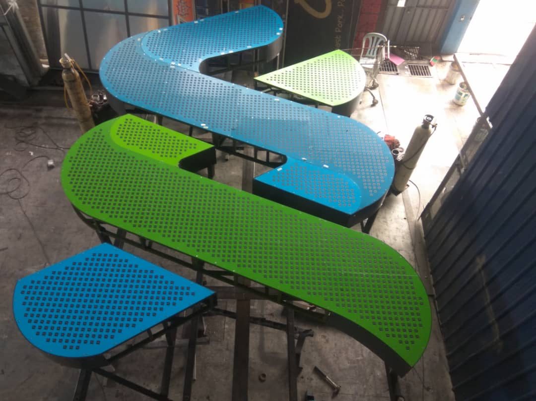 Signage letterform fabrication in the workshop